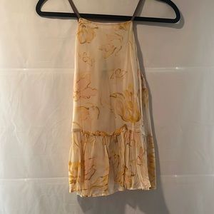 Square neck tank with ruffle hem in beautiful floral print.